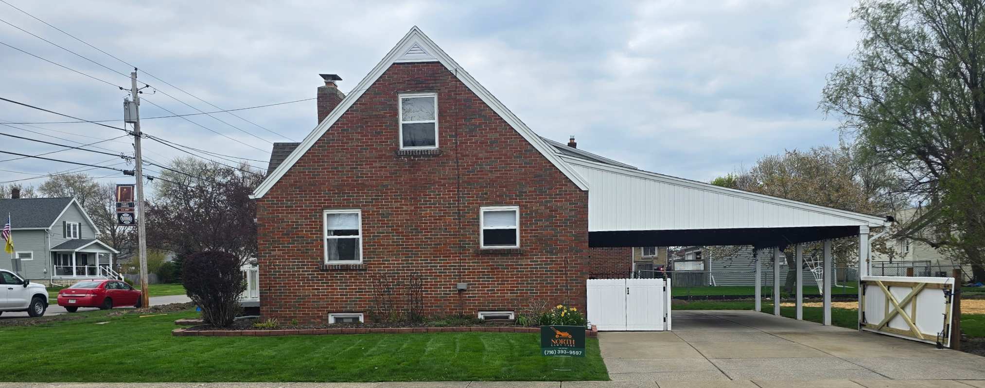 Neatly trimmed lawn around obstacles in Depew NY